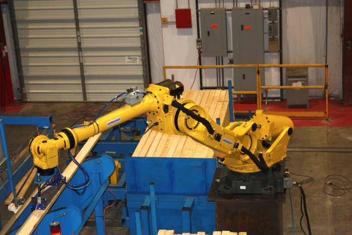 And they don't ask for raises or take sick days ... one of the robotic installations in the construction assembly line on the enormous factory floor. In the future the plant may turn out affordable and/or emergency housing.