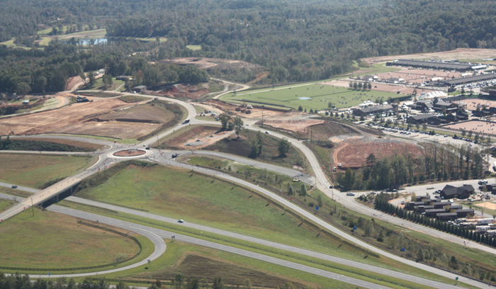 The area roads are being improved to allow better traffic flow, including this new traffic circle near the entrance.