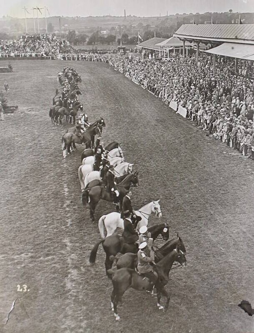 An old black-and-white photo of horses and riders lined up at Aachen.