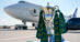 A large aircraft with the Rolex trophy in the foreground.
