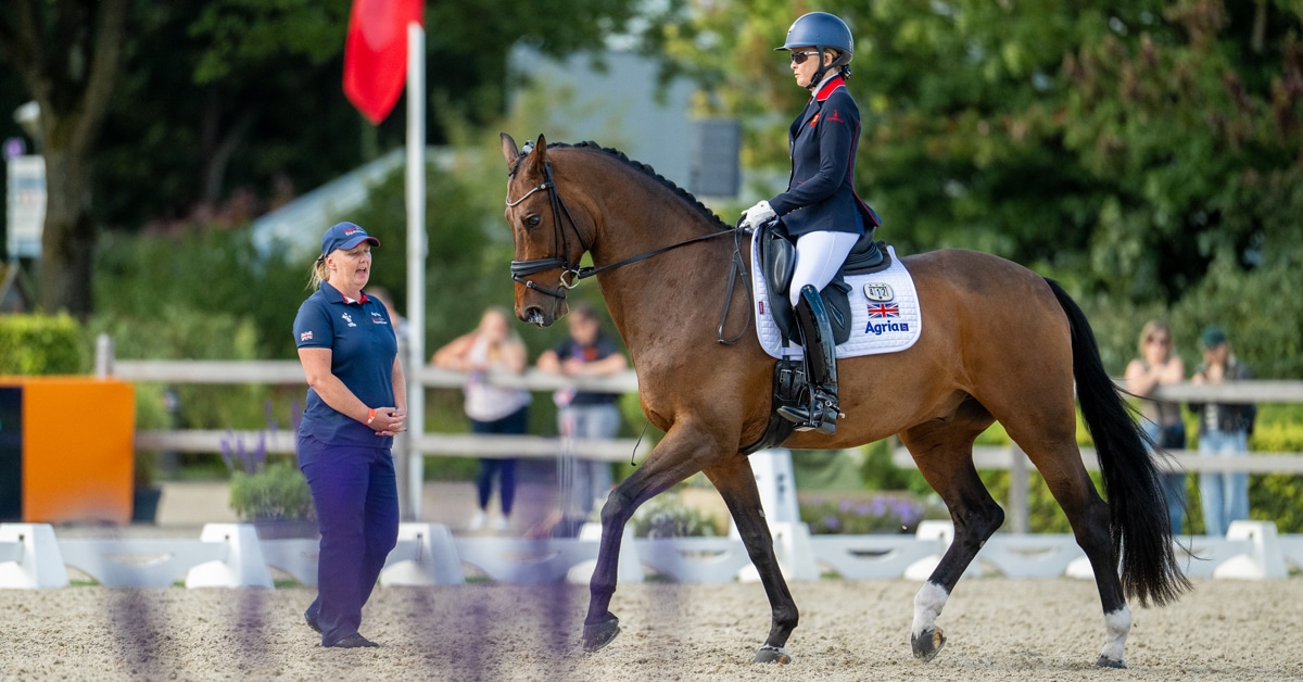 A caller and a blind para dressage rider.