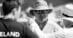 Black and white photo of a man wearing a hat.