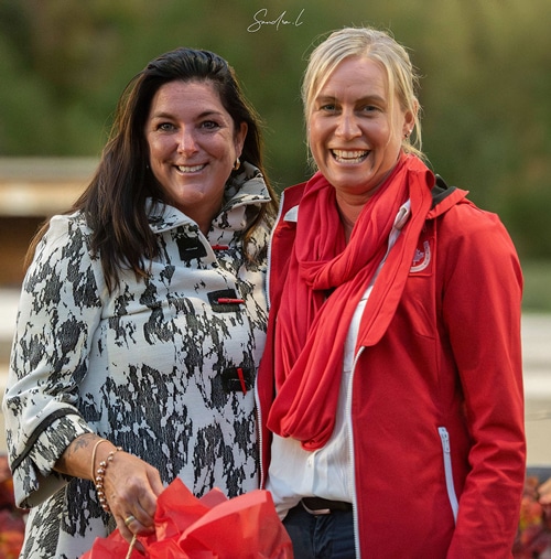 Two smiling women posing for a photo.