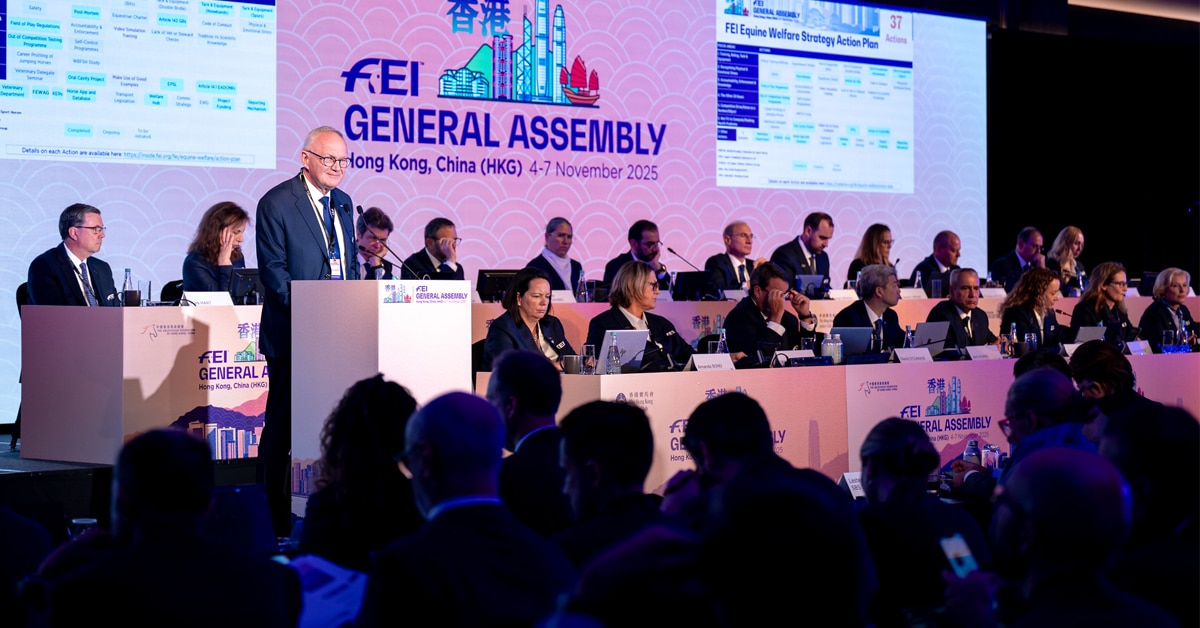 A large meeting room full of people.