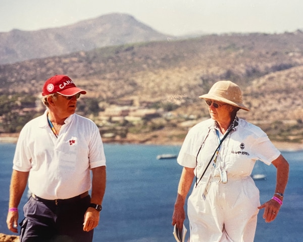 A man and women by the sea in Greece.