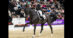 A woman riding a black dressage horse during a test in Switzerland.