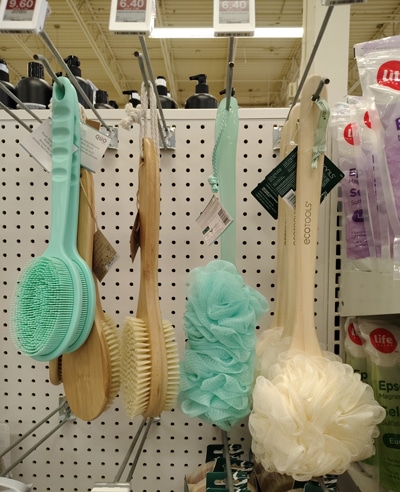 Long-handled scrubbers in a store display.