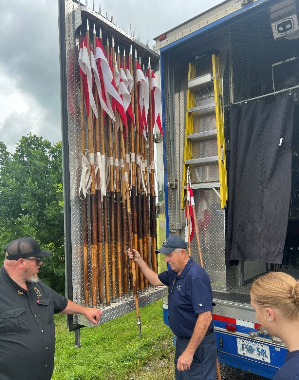 Lances hanging on a trailer door.