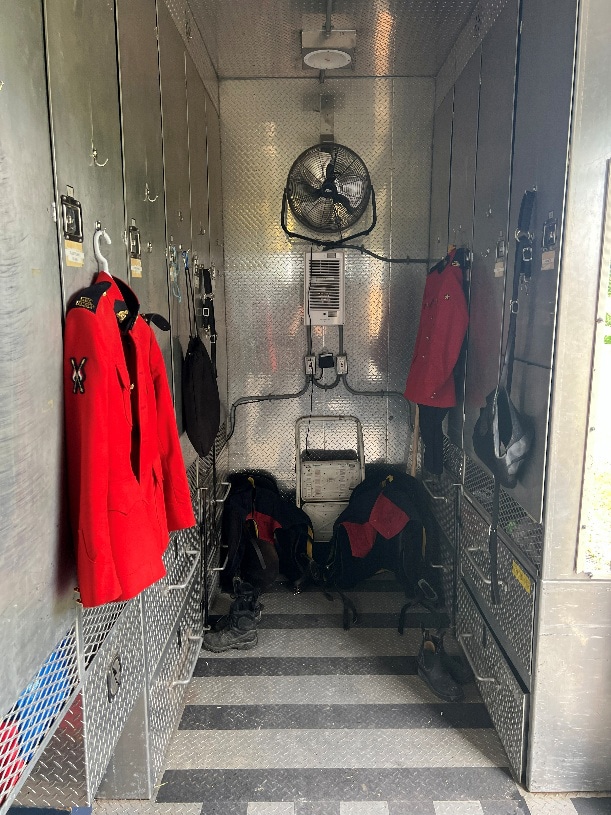 A red jacket hanging in a trailer.