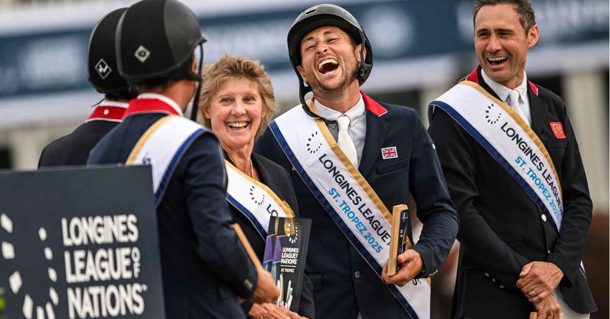 Team Great Britain laughing on the podium in France.