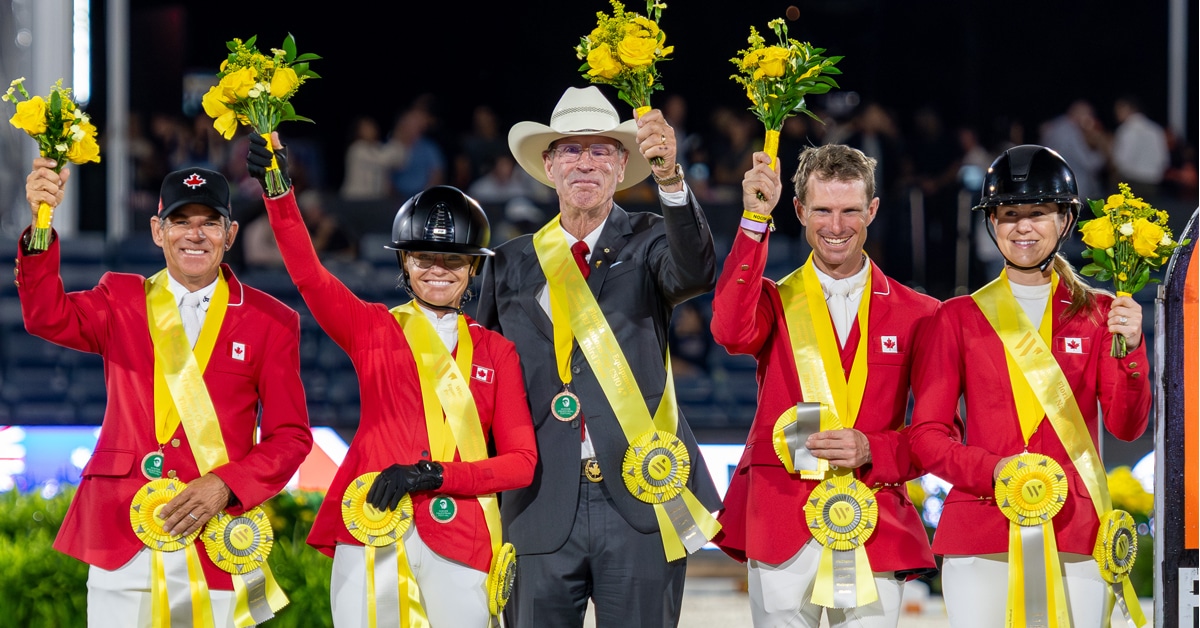 The Canadian Team, smiling and waving flowers.