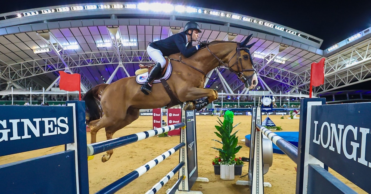 A horse and rider jumping a fence at Al Shaqab in Doha.