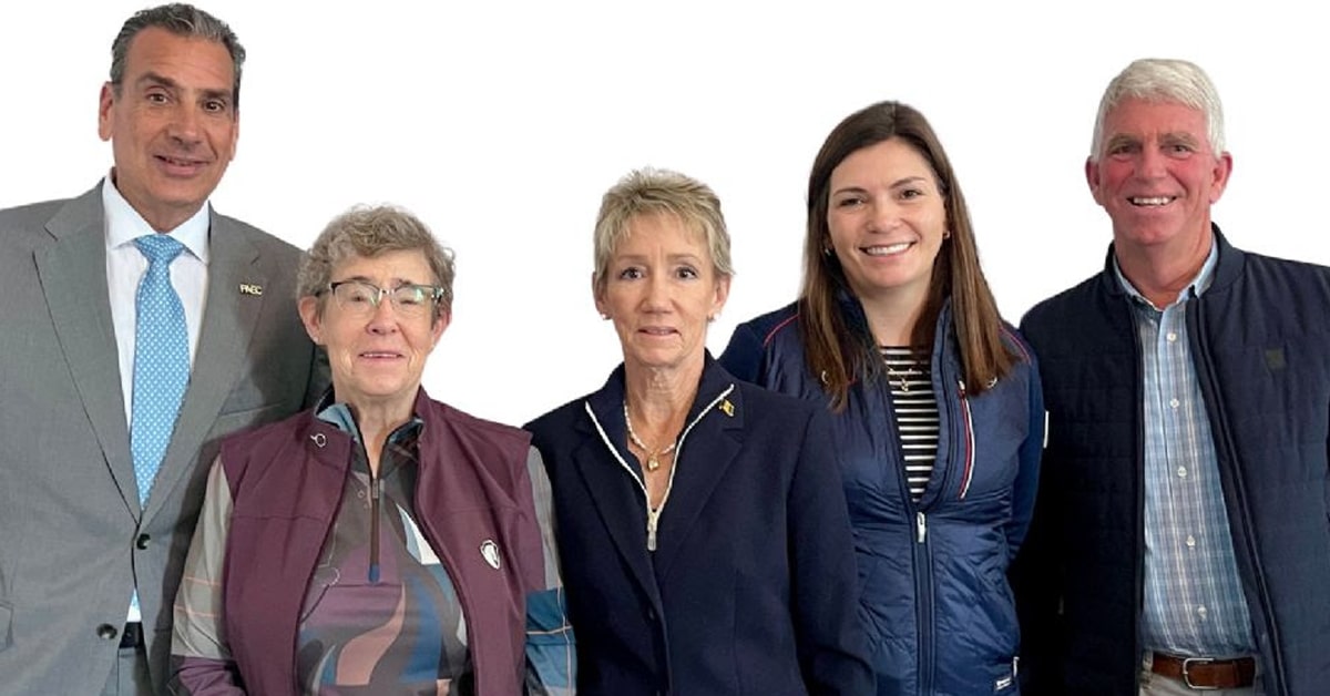 A portrait shot of five people.