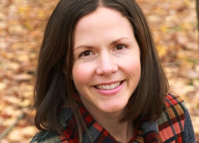 A smiling brunette woman.