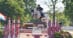 A woman jumping a grey horse over a fence in Kentucky.