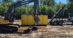 Excavators working in a riding ring.