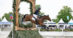 A man jumping a bay horse through a keyhole cross-country fence.
