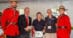RCMP members with 3 people during an awards ceremony.
