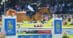 A man jumping a chestnut horse over a fence at Spruce Meadows.