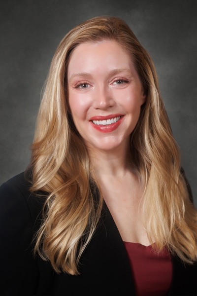 A smiling blonde woman.