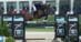 A man jumping a bay horse over a fence