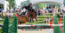 A man jumping a bay horse over a fence at Bromont.