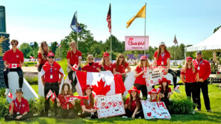 A group of young riders with Canadian flags.
