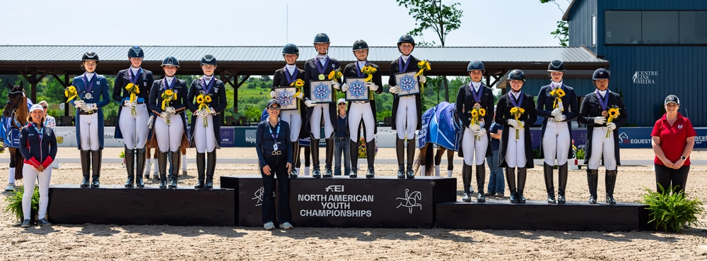 Three teams of dressage riders standing on a podium.