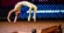 A female vaulter doing a backflip.