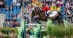 A man jumping a bay horse over a large fence in Aachen.