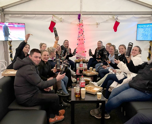 A group of people in a groom's lounge.