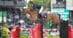 A man jumping a bay horse over a fence at Spruce Meadows.