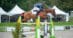 A man jumping a bay horse over a fence at Bromont.